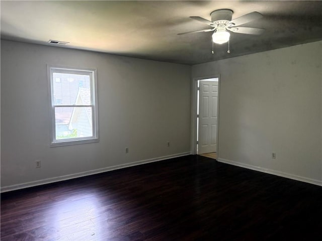 210 Ormond St SW, Atlanta, GA 30315 - empty room with dark wood finished floors, baseboards, and ceiling fan