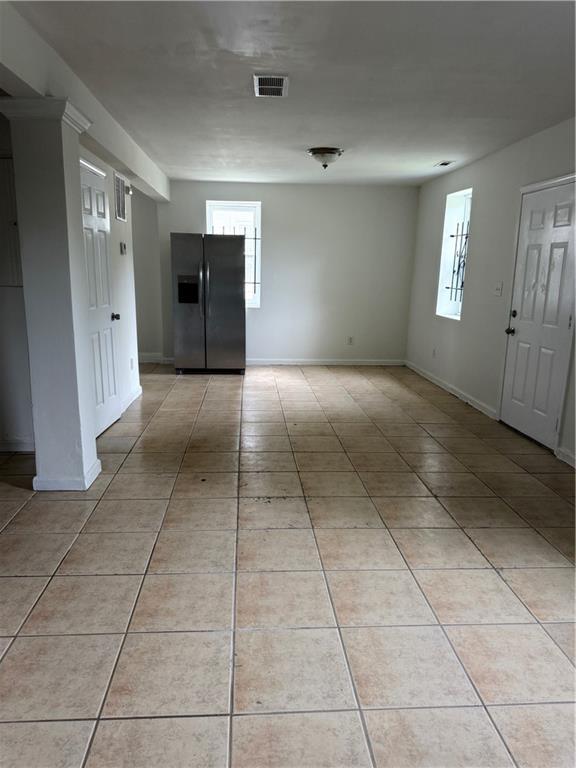 210 Ormond St SW, Atlanta, GA 30315 - spare room featuring light tile patterned flooring and baseboards