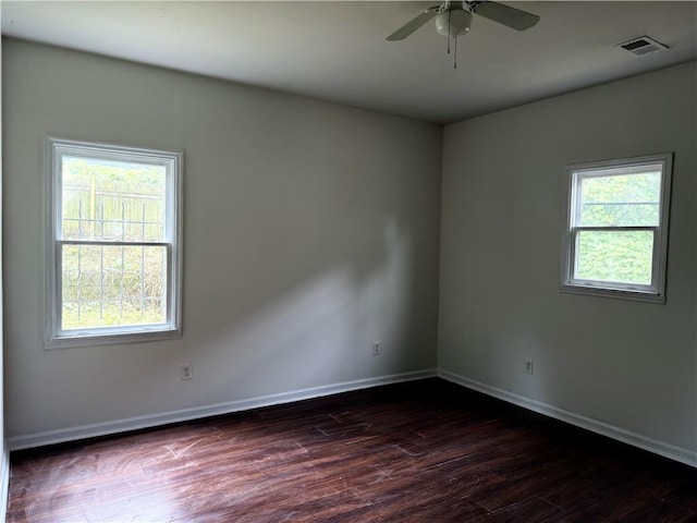 210 Ormond St SW, Atlanta, GA 30315 - spare room with dark wood-type flooring, baseboards, and a ceiling fan