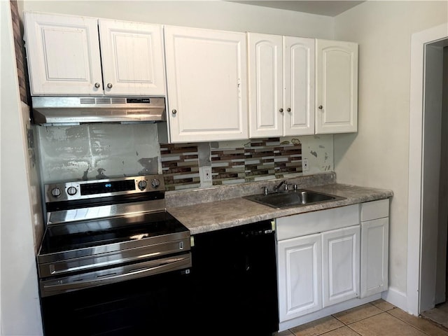 210 Ormond St SW, Atlanta, GA 30315 - kitchen with stainless steel electric stove, under cabinet range hood, a sink, and tasteful backsplash