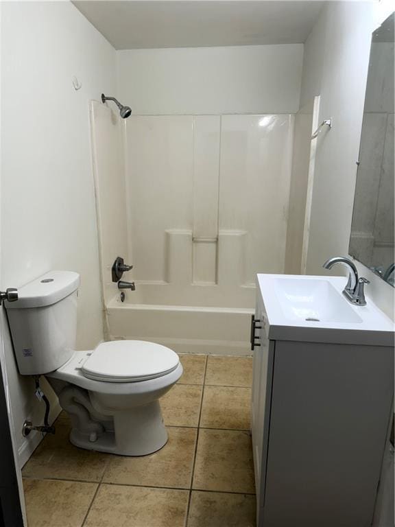 210 Ormond St SW, Atlanta, GA 30315 - full bathroom featuring vanity, toilet, tile patterned floors, and bathtub / shower combination