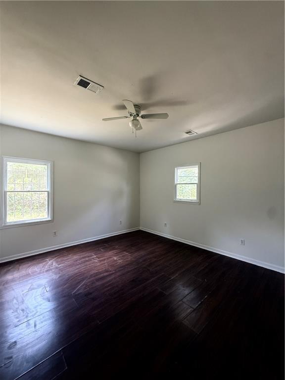 210 Ormond St SW, Atlanta, GA 30315 - empty room with baseboards, dark wood finished floors, and ceiling fan