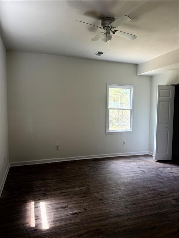 210 Ormond St SW, Atlanta, GA 30315 - unfurnished room featuring dark wood finished floors, baseboards, and ceiling fan