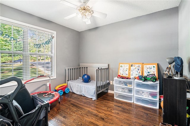 bedroom featuring wood finished floors and a ceiling fan