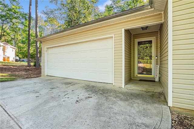 garage featuring driveway
