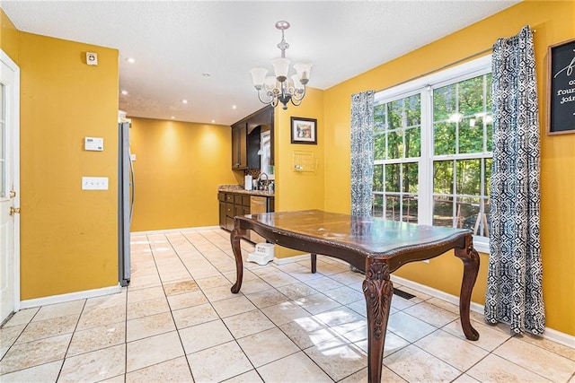 dining area with a chandelier, light tile patterned flooring, recessed lighting, and baseboards