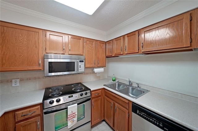 1800 Clairmont Lk Unit 326, Decatur, GA 30033 - kitchen with brown cabinetry, stainless steel appliances, light countertops, and a sink