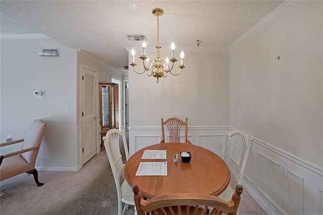 1800 Clairmont Lk Unit 326, Decatur, GA 30033 - dining area featuring a textured ceiling, an inviting chandelier, crown molding, and carpet