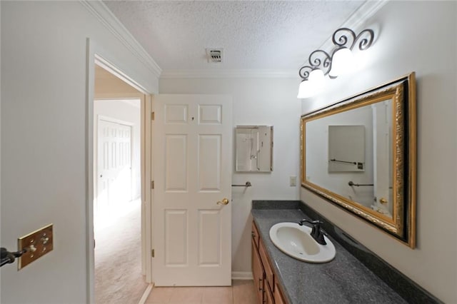1800 Clairmont Lk Unit 326, Decatur, GA 30033 - bathroom with visible vents, crown molding, vanity, tile patterned floors, and a textured ceiling