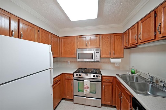 1800 Clairmont Lk Unit 326, Decatur, GA 30033 - kitchen featuring brown cabinetry, stainless steel appliances, light countertops, and a sink
