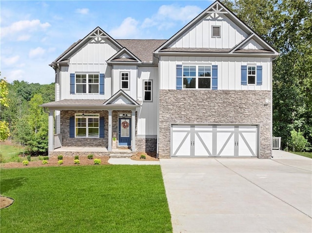 craftsman house featuring a garage and a front yard