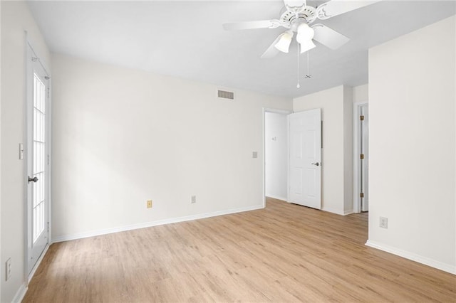 unfurnished bedroom with light wood-type flooring, baseboards, visible vents, and ceiling fan