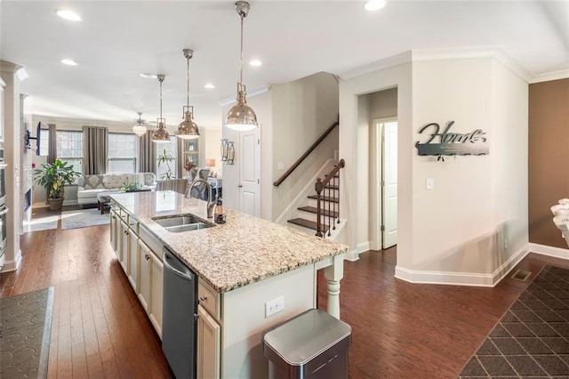 kitchen with sink, hanging light fixtures, stainless steel dishwasher, an island with sink, and dark hardwood / wood-style flooring