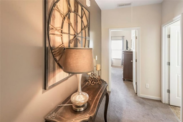 hallway featuring carpet flooring