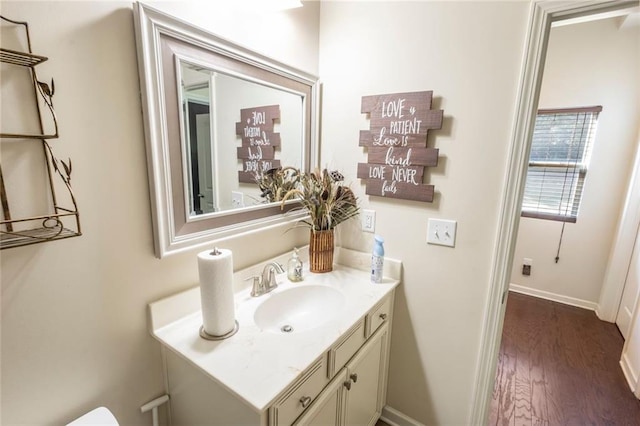 bathroom with vanity and hardwood / wood-style flooring