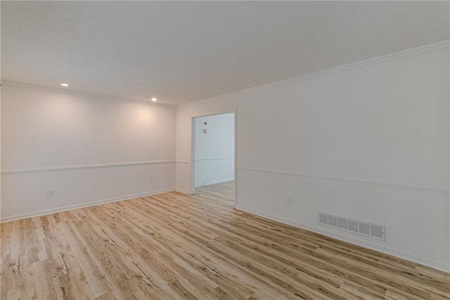 7020 Camp Valley Rd, Riverdale, GA 30296 - unfurnished room with baseboards, visible vents, ornamental molding, and light wood-style flooring