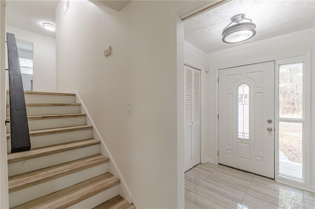 7020 Camp Valley Rd, Riverdale, GA 30296 - foyer featuring a textured ceiling and stairway