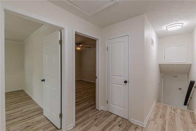 7020 Camp Valley Rd, Riverdale, GA 30296 - hall featuring baseboards, a textured ceiling, and light wood finished floors
