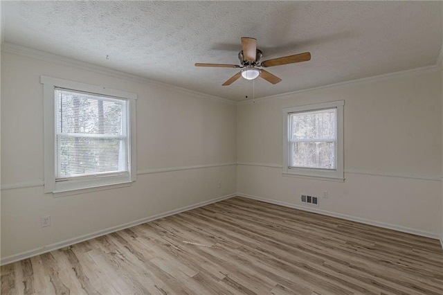 7020 Camp Valley Rd, Riverdale, GA 30296 - spare room with visible vents, a ceiling fan, light wood finished floors, and a wealth of natural light