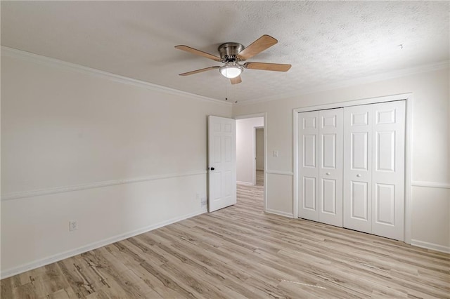 7020 Camp Valley Rd, Riverdale, GA 30296 - unfurnished bedroom with crown molding, a closet, baseboards, ceiling fan, and light wood finished floors
