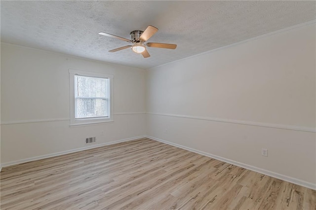 7020 Camp Valley Rd, Riverdale, GA 30296 - unfurnished room featuring visible vents, a textured ceiling, light wood finished floors, and a ceiling fan