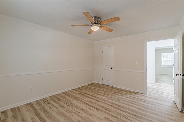 7020 Camp Valley Rd, Riverdale, GA 30296 - spare room with crown molding, baseboards, a ceiling fan, and light wood-type flooring