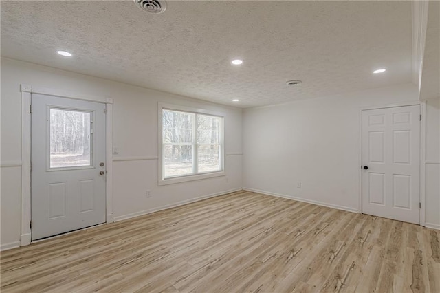 7020 Camp Valley Rd, Riverdale, GA 30296 - foyer featuring recessed lighting, light wood-type flooring, a textured ceiling, and visible vents