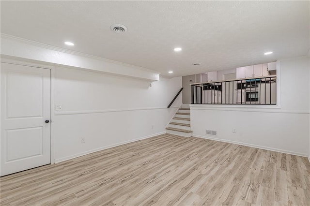 7020 Camp Valley Rd, Riverdale, GA 30296 - finished basement featuring recessed lighting, visible vents, and light wood-style floors