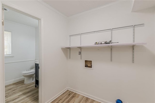 7020 Camp Valley Rd, Riverdale, GA 30296 - washroom featuring crown molding, washer hookup, baseboards, and light wood-type flooring