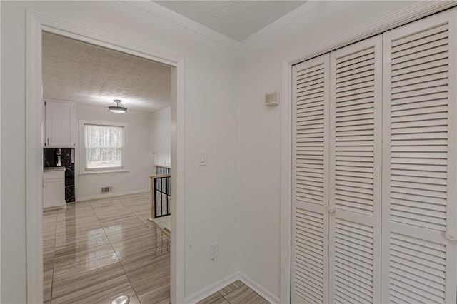 7020 Camp Valley Rd, Riverdale, GA 30296 - hall with a textured ceiling, baseboards, an upstairs landing, light tile patterned floors, and visible vents