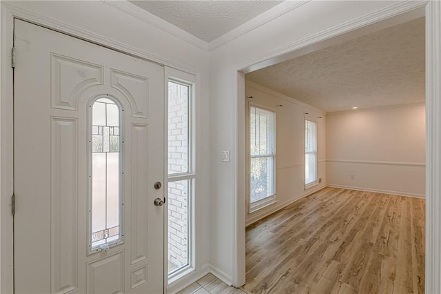 7020 Camp Valley Rd, Riverdale, GA 30296 - foyer entrance with baseboards, a textured ceiling, and a healthy amount of sunlight