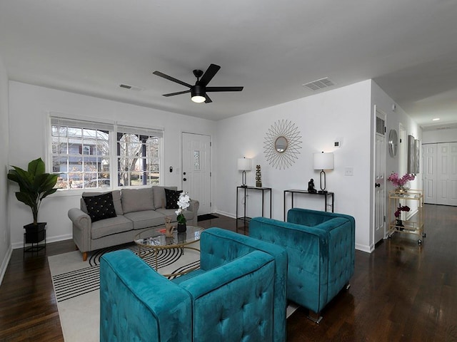 living room featuring dark hardwood / wood-style floors and ceiling fan