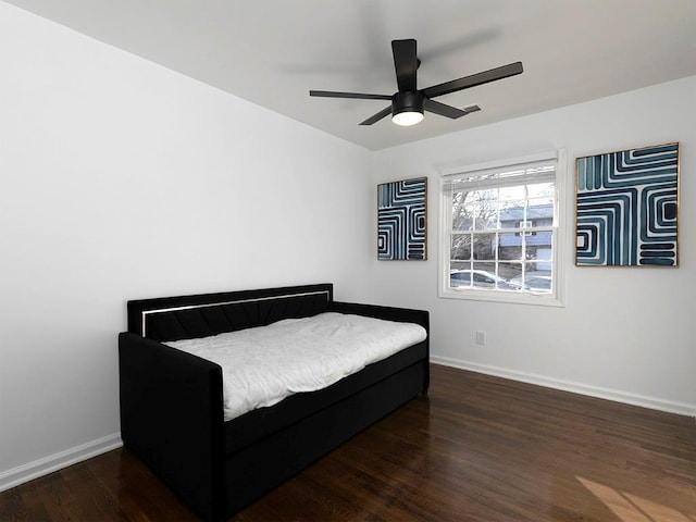 bedroom featuring ceiling fan and dark hardwood / wood-style floors