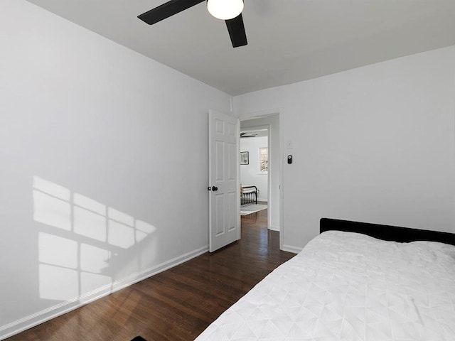 bedroom featuring dark wood-type flooring and ceiling fan