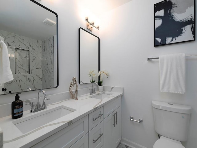 bathroom featuring vanity, walk in shower, and toilet