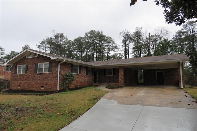 single story home featuring an attached carport, a front yard, driveway, crawl space, and brick siding