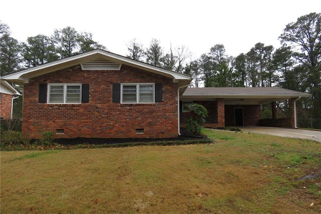 view of front of house featuring a front lawn, driveway, a carport, crawl space, and brick siding