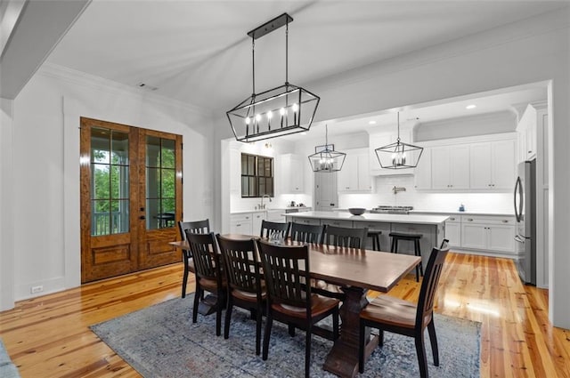 330 Shagbark Way, Harlem, GA 30814 - dining space featuring light wood-style flooring, a chandelier, and ornamental molding