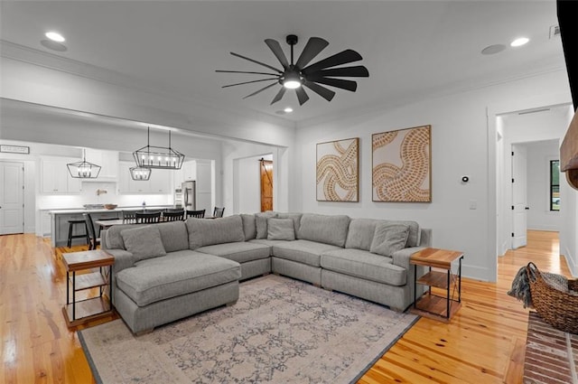330 Shagbark Way, Harlem, GA 30814 - living area featuring ornamental molding, light wood finished floors, a ceiling fan, recessed lighting, and baseboards
