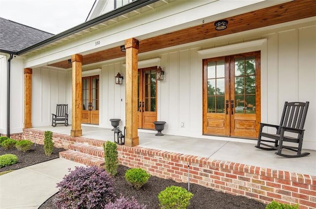 330 Shagbark Way, Harlem, GA 30814 - entrance to property featuring french doors, covered porch, board and batten siding, and a shingled roof