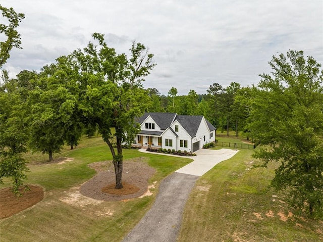 330 Shagbark Way, Harlem, GA 30814 - modern farmhouse style home featuring concrete driveway, a front lawn, a garage, and covered porch