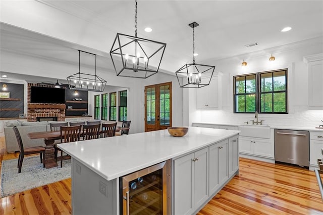 330 Shagbark Way, Harlem, GA 30814 - kitchen with wine cooler, dishwasher, light wood-type flooring, white cabinetry, and recessed lighting