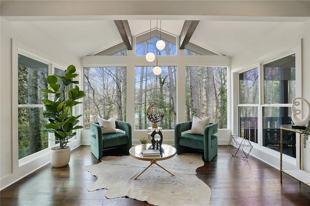 sunroom / solarium with vaulted ceiling with beams and a healthy amount of sunlight