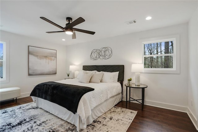 bedroom with recessed lighting, visible vents, a ceiling fan, wood finished floors, and baseboards