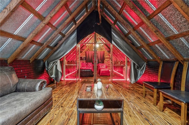 living room with hardwood / wood-style flooring and lofted ceiling