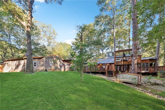 view of yard featuring a wooden deck