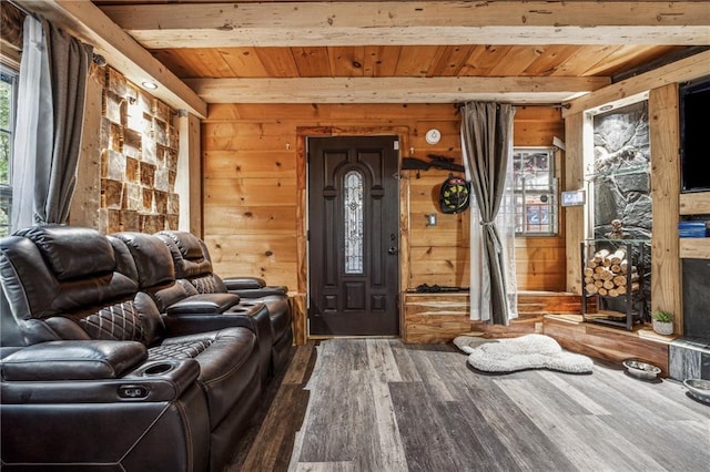 living room featuring wood-type flooring, wood walls, wooden ceiling, and beam ceiling