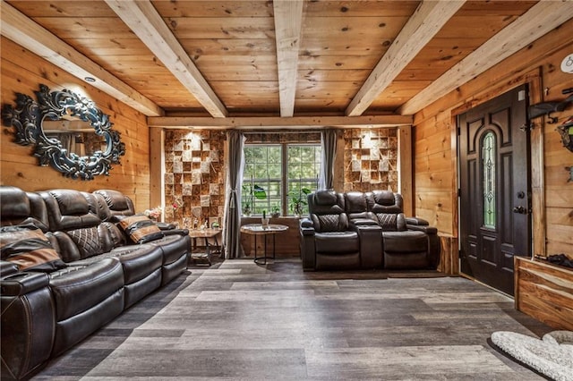 living room featuring beam ceiling, dark hardwood / wood-style floors, wooden walls, and wood ceiling