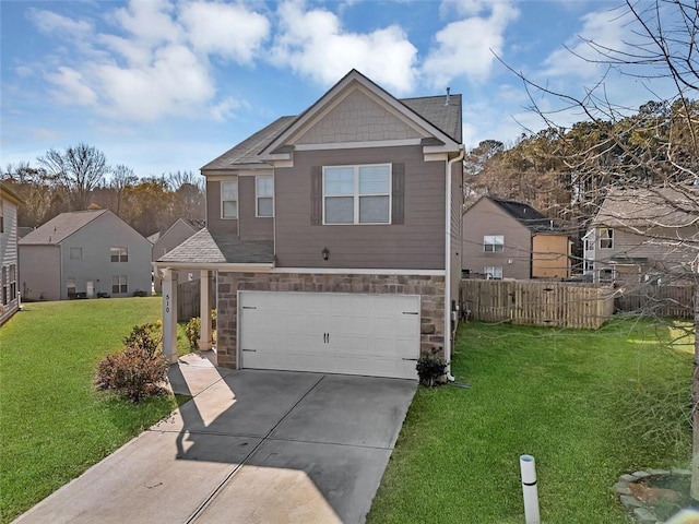 view of front of house featuring a front yard and a garage