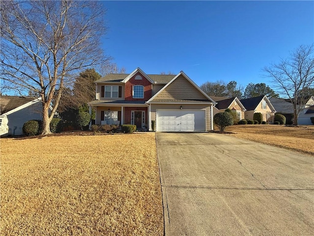 view of front of home featuring a garage, brick siding, driveway, and a front lawn